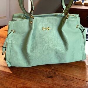 Jessica Simpson aqua teal double strap handbag with gold tone hardware.